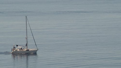 Sail boat in the sea. Marine transportation, wind, travel in the ocean. Sailing boat, nautical sport