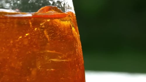 Orange Beverage with Ice and Slice of Orange