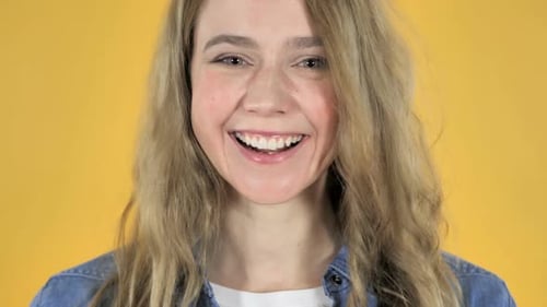 Smiling Woman Portrait on Yellow Background
