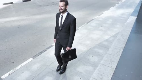 Walking Young Businessman to Office