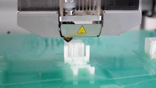 3D Printer Working and Creating an Object From the Hot Molten Plastic