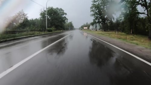 Moving on Empty Countryside Road During Heavy Rain