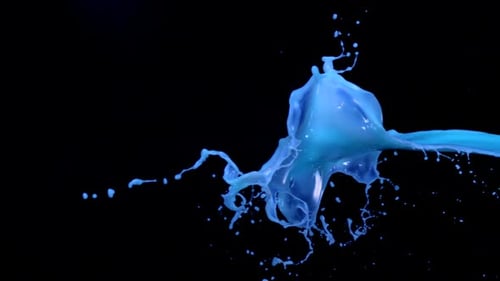 Vibrant Light Blue Liquid Splash Against Black Background