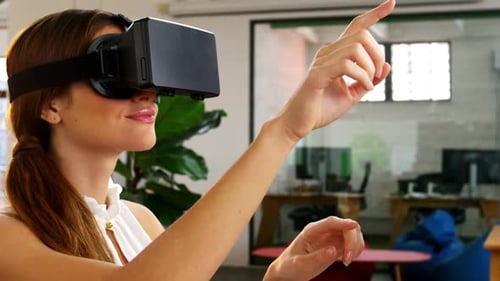 Woman Interacting with Virtual Reality Headset in Office