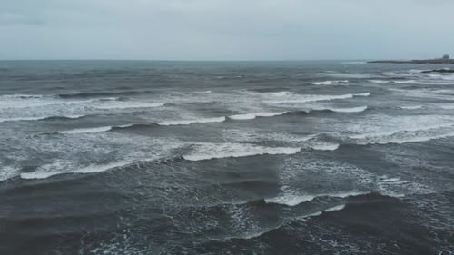storm waves in the ocean in cloudy weather