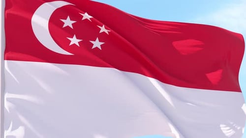 Singapore National Flag Waving Against Blue Sky