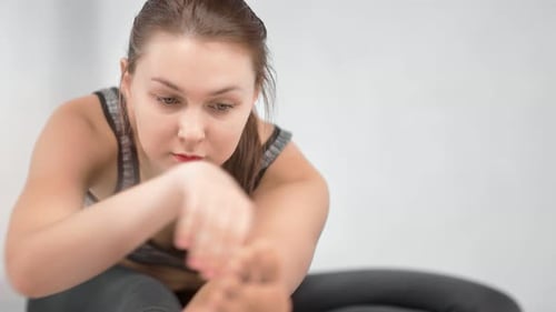 Woman Stretching Leg for Fitness and Flexibility