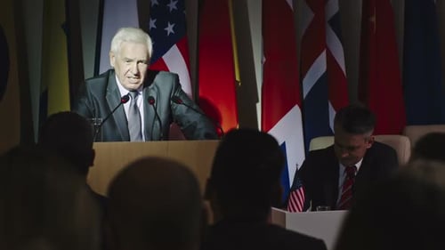 Speaker Addresses Audience at Political Conference