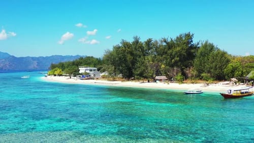 Aerial drone shot tourism of tropical island beach journey by aqua blue water with white sandy backg