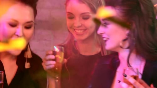 Friends Celebrate Birthday With Champagne and Confetti