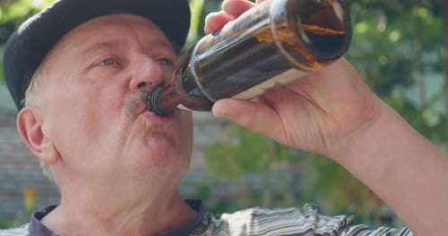 Old Man Drinking Beer