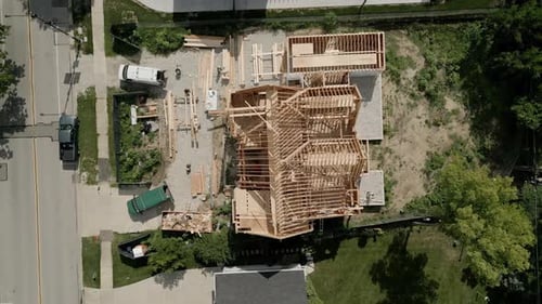 Aerial Top View of Workers Building New Residential Home