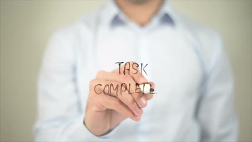 Task Completed Man Writing on Transparent Screen