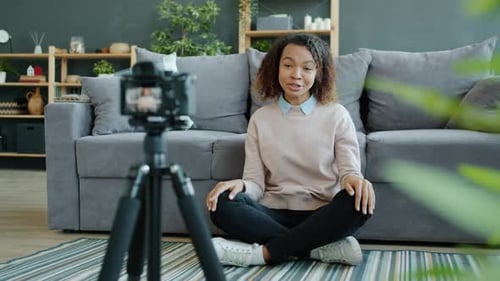 Young Woman Records a Video Blog at Home