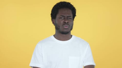 Man Making No Gesture Against Yellow Background