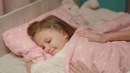 Caring for Sick Child in Bed at Home