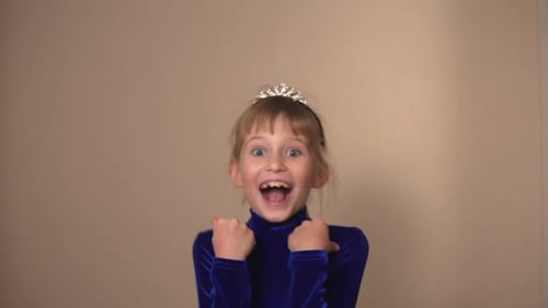 Excited Girl Smiling, Wearing a Tiara