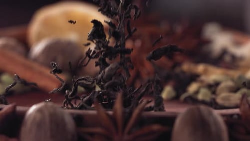 Tea Leaves Falling onto Spices Cooking Preparation