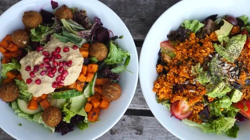 Two Fresh, Healthy Salad Bowls on Table