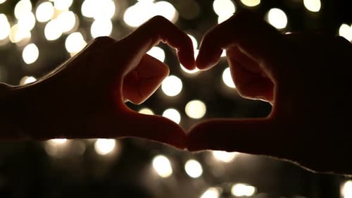 People Making Heart Shape with Hands
