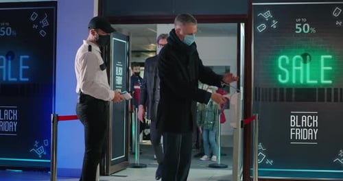 Adults and Children Enter Store for Black Friday Sales