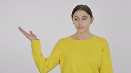 Smiling Woman Gestures to the Left