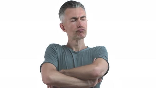 Man with Gray Hair Looks Around, Arms Crossed