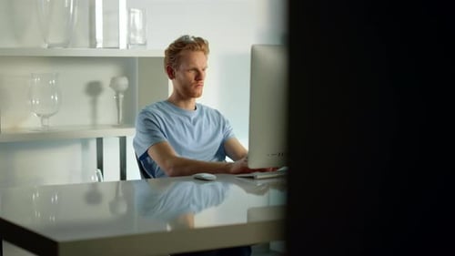 Office Worker Typing Computer Keyboard Writing Email at Cozy Remote Workplace