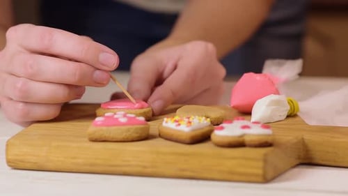 Decorating Heart Cookies with Pink and White Icing