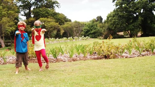 Kids Play Superhero in Green Suburban Garden