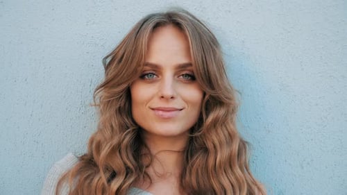 Smiling Woman with Wavy Hair Close Up