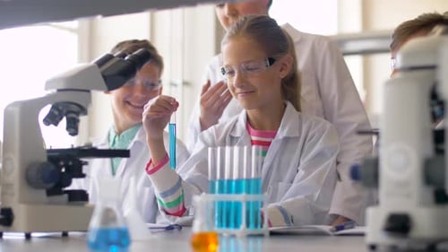 Teacher and Students Studying Chemistry at School 8