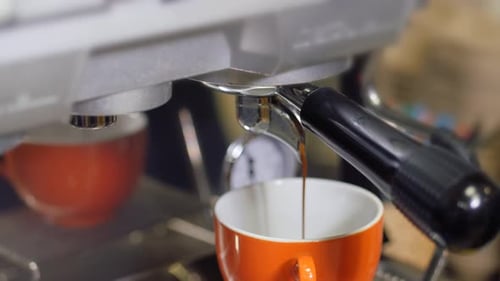 Process of Making Lattes on a Coffee Machine the Camera is in Motion