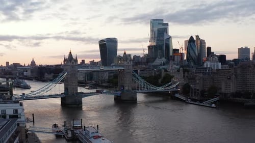 Cars and Red Double Decker Driving Through Historic Tower Bridge Across River Thames in Sunset Time