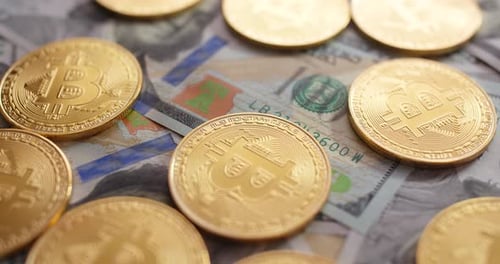 Bitcoins on Top of US Dollar Bills