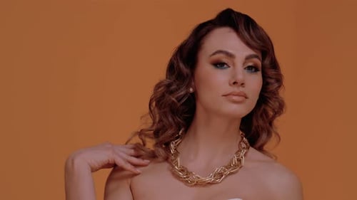 Woman Posing with Gold Chain Necklace