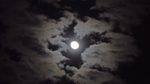 Dramatic Moon with Fast Moving Clouds at Night