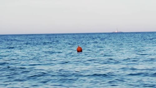 Buoy in the open sea. Lonely buoy in beautiful blue sea
