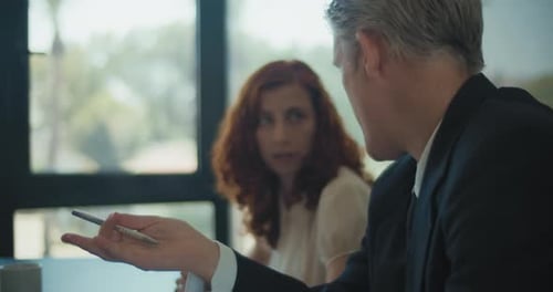 Business Meeting in Office Environment with Natural Light