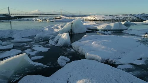 Flying Above Floating Icebergs. Ice From Glacier Crystal Shining. Ice Lagoon Global Warming