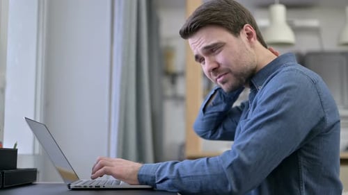 Beard Young Man Having Neck Pain on Office Desk