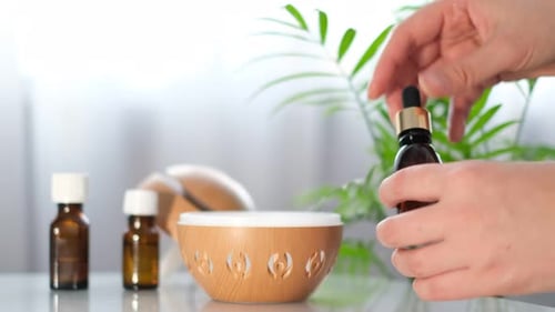 Aromatherapy Diffuser and Bottle of Essential Oil