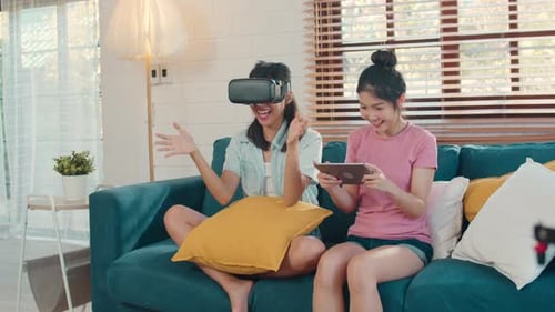 Young Women Enjoying VR and Tablet Games at Home