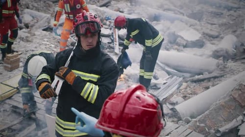 Rescue Workers Searching Through Rubble After Building Collapse