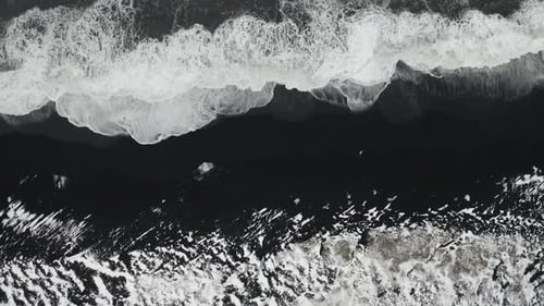 Aerial View of Black Sand Beach in Cloudy Weather. The Beginning of Spring in Iceland