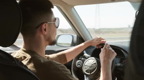 Man Driving Car on Highway During Daytime