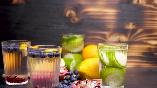 Infused Water with Fruits on Wooden Background