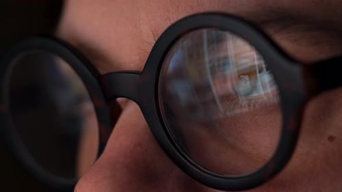 Close Up of Glasses Reflecting Computer Screen