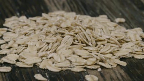 Heap of Uncooked Rolled Oats Close Up