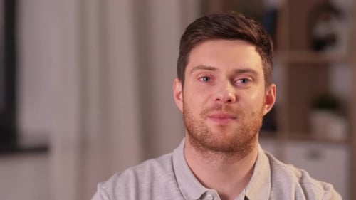 Portrait of Happy Smiling Young Man at Home